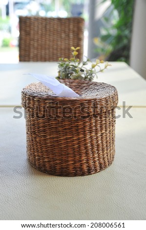 Wicker tissue paper box on table