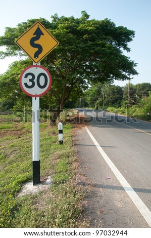 Curved Road Traffic Sign on a Rural Road