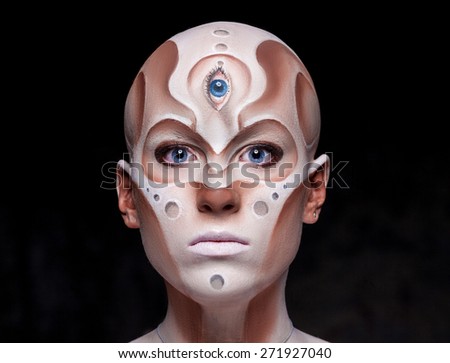 Portrait of a mysterious woman with a fantastic makeup Alien