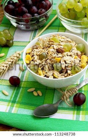 Breakfast with muesli and grapes