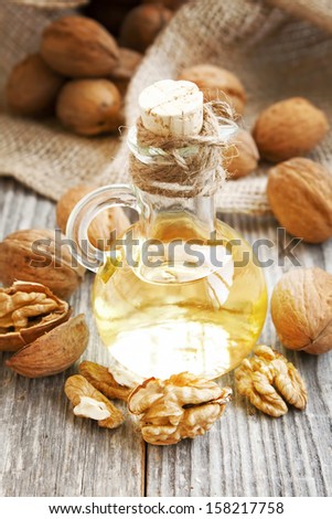 Bottle of walnut oil with walnuts  and kernels,healthy fats