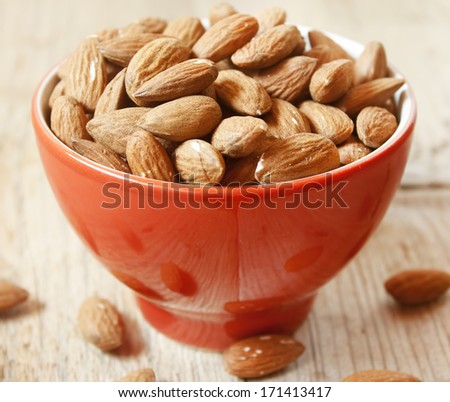 Almonds placed in a red bowl,healthy fruits