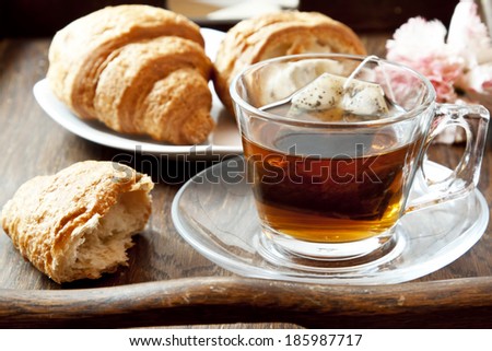 Fresh Tea in Transparent Cup with Croissants, Morning Breakfast with Tea