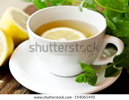 Cup of Lemon Tea with Mint Leaves, Classic White Cup of Tea
