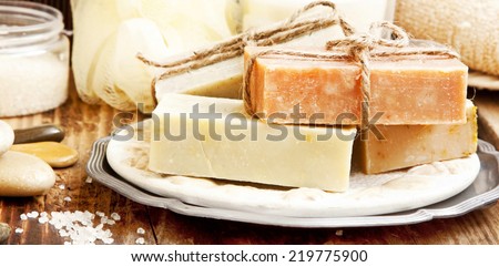 Natural Soap. Spa setting with Sea Salt and Natural Soap on Wooden Table