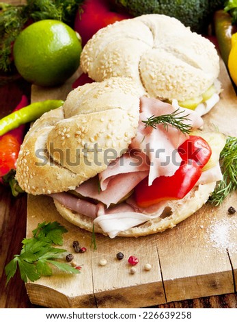 Fresh Ham Sandwiches with Pepper, Dill and Parsley on Wooden Board