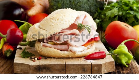 Fresh Ham Sandwiches with Pepper and Parsley on Wooden Board