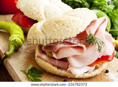 Fresh Ham Sandwiches with Pepper, Dill and Parsley on Wooden Board