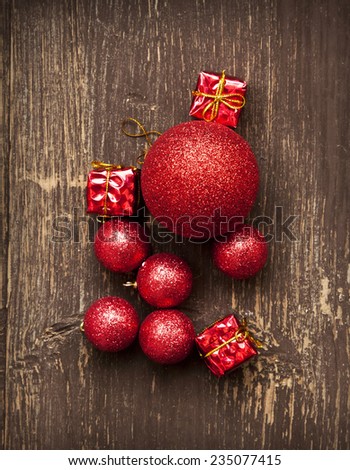 Vintage Decorations, Christmas Red Balls and Gifts on Wooden Background