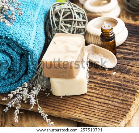 Spa Setting with Bodycare Products.Natural Soap with Lavender Flowers and Essential Oil Bottle
