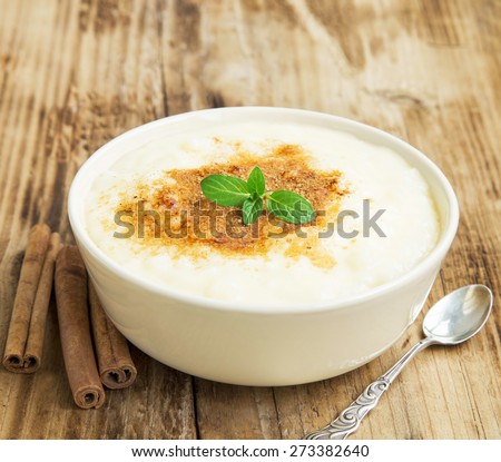 Vanilla Rice Pudding with Cinnamon Powder and Mint Leaf, Delicious Dessert