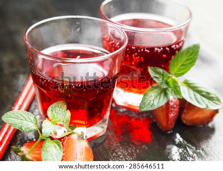 Refreshing Red Juice with Strawberries and Mint in Transparent Glasses