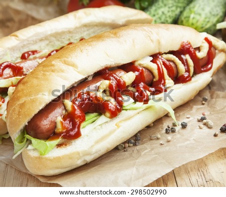 Hot-Dog Meal.Sausages with Bread Buns,Lettuce, Mustard and Ketchup Sauces