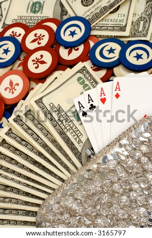 money background- gamblers  purse full of four aces, hundred dollar bills, with poker chips