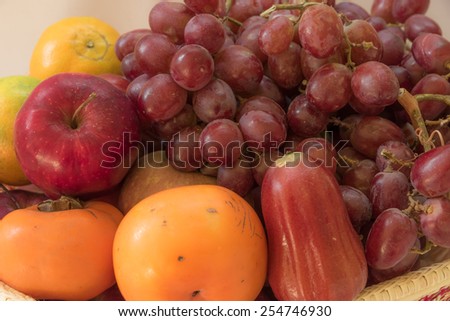 Fresh autumn fruits - rose apple, plums, grapes,orange and apples