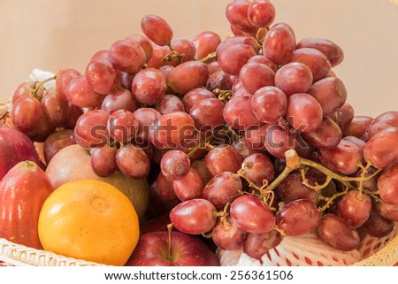 Fresh autumn fruits - rose apple, grapes,orange and apples