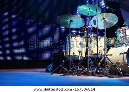 Drum Set with some cymbals on stage before a live Concert.