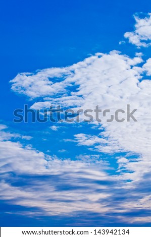 Beautiful Blue Sky Background with white clouds in angel wing form