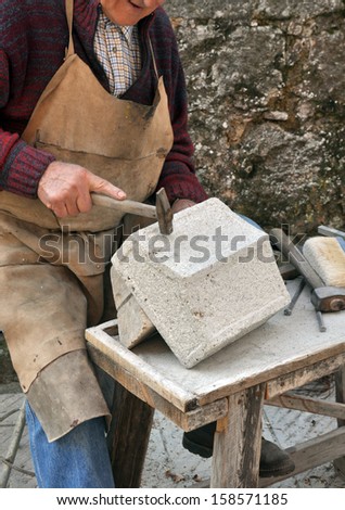 Stonemason. Hands detail of craftsman at work