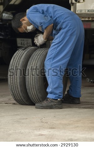 Man repairing a flat tire
