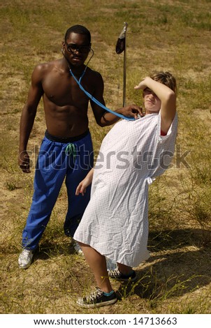 Woman falling in love with her male nurse while he checks her hearth rate