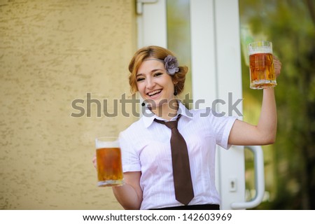 waiter with beer in the hands