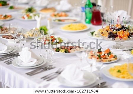 table set service with silverware and glass stemware at restaurant before party