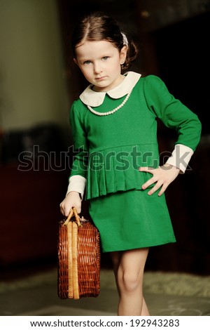 Portrait of lovely girl dressed in green dress