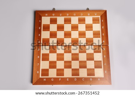 empty wooden chess desk on grey background