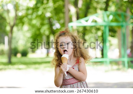 Portrait of Little pretty girl with ice cream