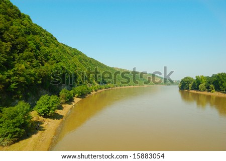 landscape with green hills, river and blue heaven