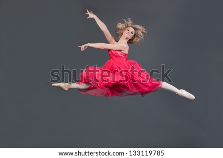 Ballerina studio portrait wearing pink sheer dress
