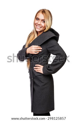 Young beautiful blonde girl in a long black of thick cloth coat with large hood black