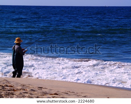 Man fishing at the ocean.