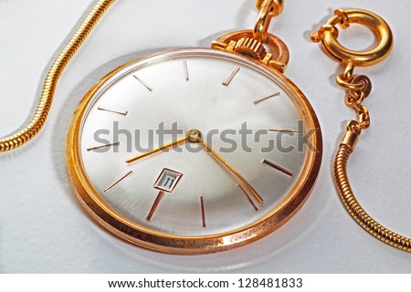An old golden pocket watch with display in mother of pearl, vintage style