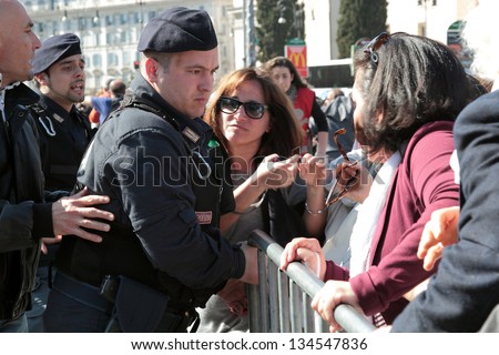 ROME, ITALY - April 07: Disorders during the settlement ceremony of Pope Francis at St.John on April 07, 2013 in Rome. After a long wait in the sun without information, the crowd challenges the police