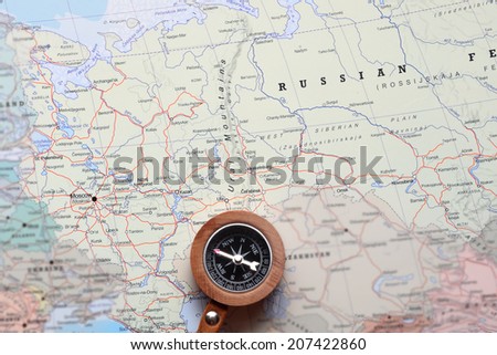 Compass on a map pointing at Moscow Russia, and planning a travel destination