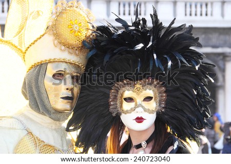 A masked couple exhibited during the traditional Carnival of Venice, Italy (2014 edition)