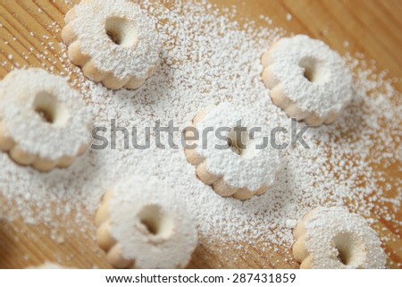 Italian canestrelli biscuits sprinkled with powdered sugar on its surface. Horizontal image
