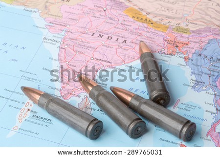 Four bullets on the geographical map of India. Conceptual image for war, conflict, violence.