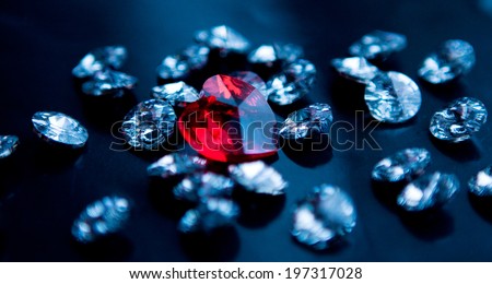 white crystals with a big red heart-shaped crystal in the center