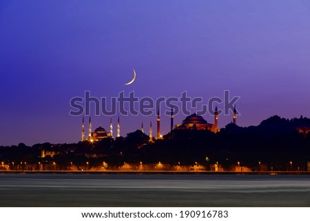 New moon over historical Eminonu peninsula at twilight, Istanbul - Turkey On the left side, you can see Blue Mosque (Sultanahmet) and on the right side, you can see Hagia Sophia.
