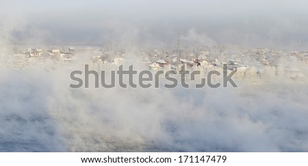 Steam over Angara-river on a frosty day. Irkutsk