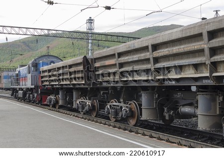 Railway freight train at the station. Irkutsk region