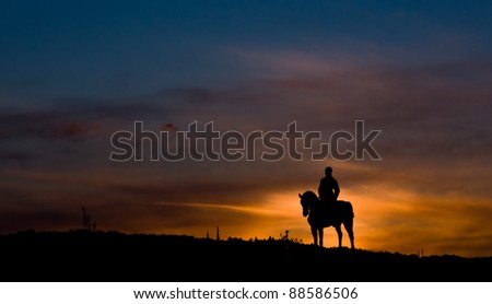 Riding a horse in sunset