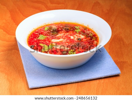 Hot vegetable soup in a bowl on the table