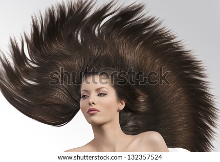 cute and young girl with hair around her and with crazy creative hairstyle