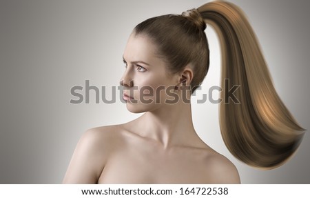 cute woman in artistic portrait with naked shoulders and long smooth hair melting in paint