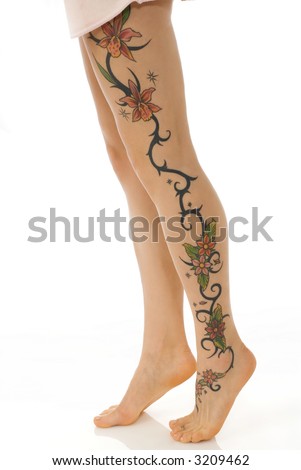 stock photo close up of the woman legs with a flower tattoo