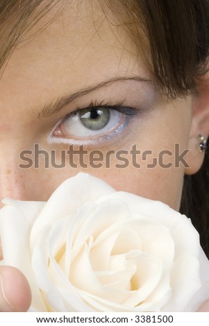 nice and young woman with roses in her hands smelling and smiling with her fair eyes